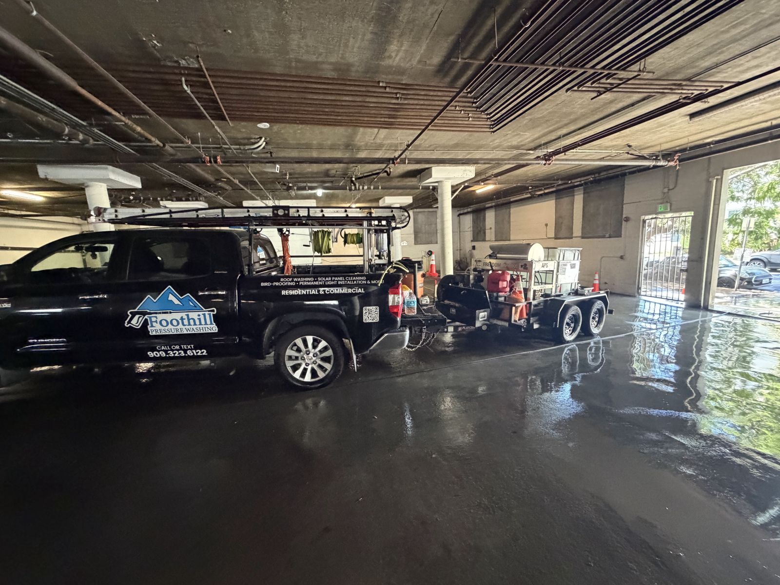 Foothill Pressure Washing truck during commercial parking garage cleaning