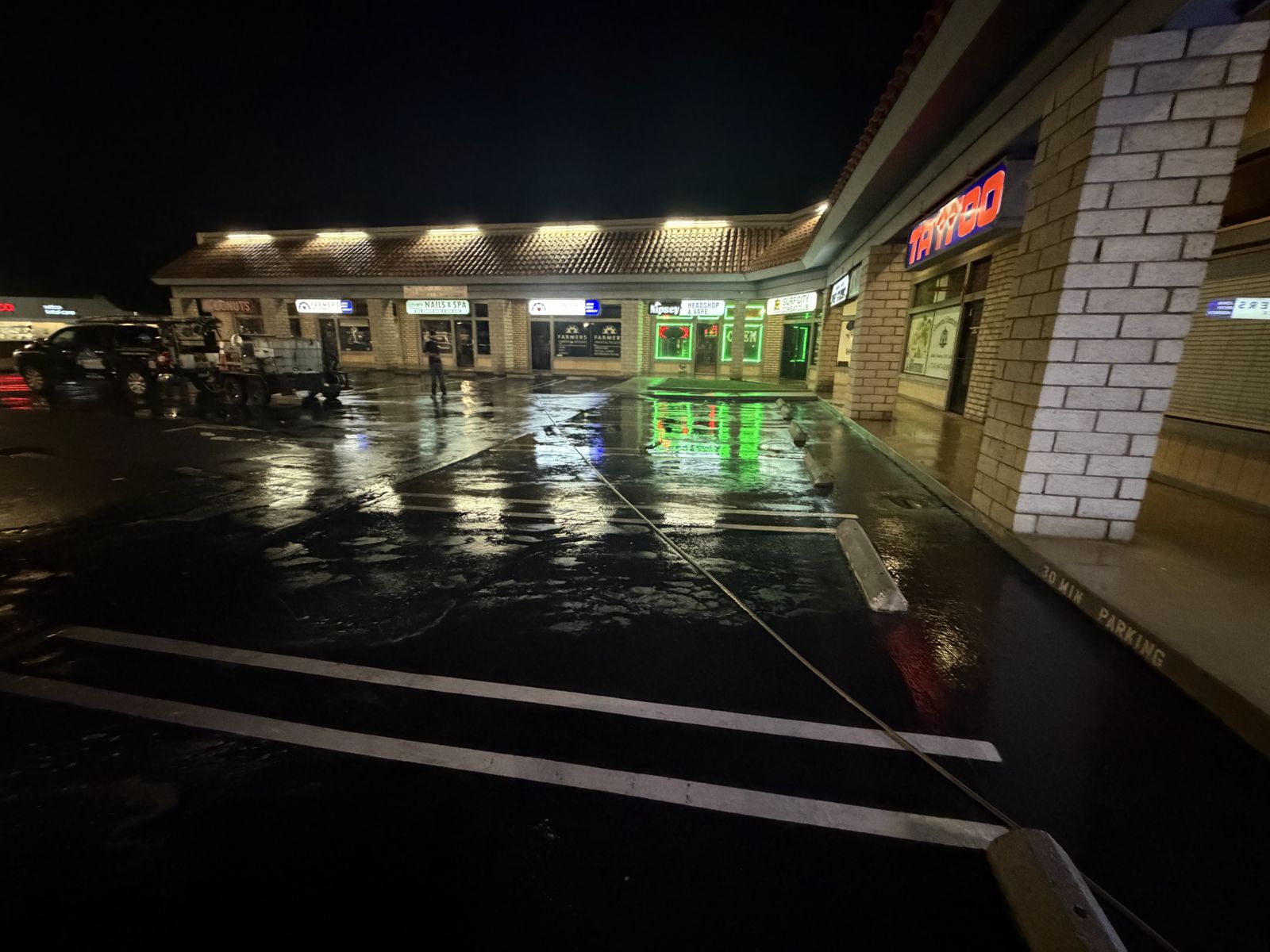 Strip mall storefront walkway after cleaning