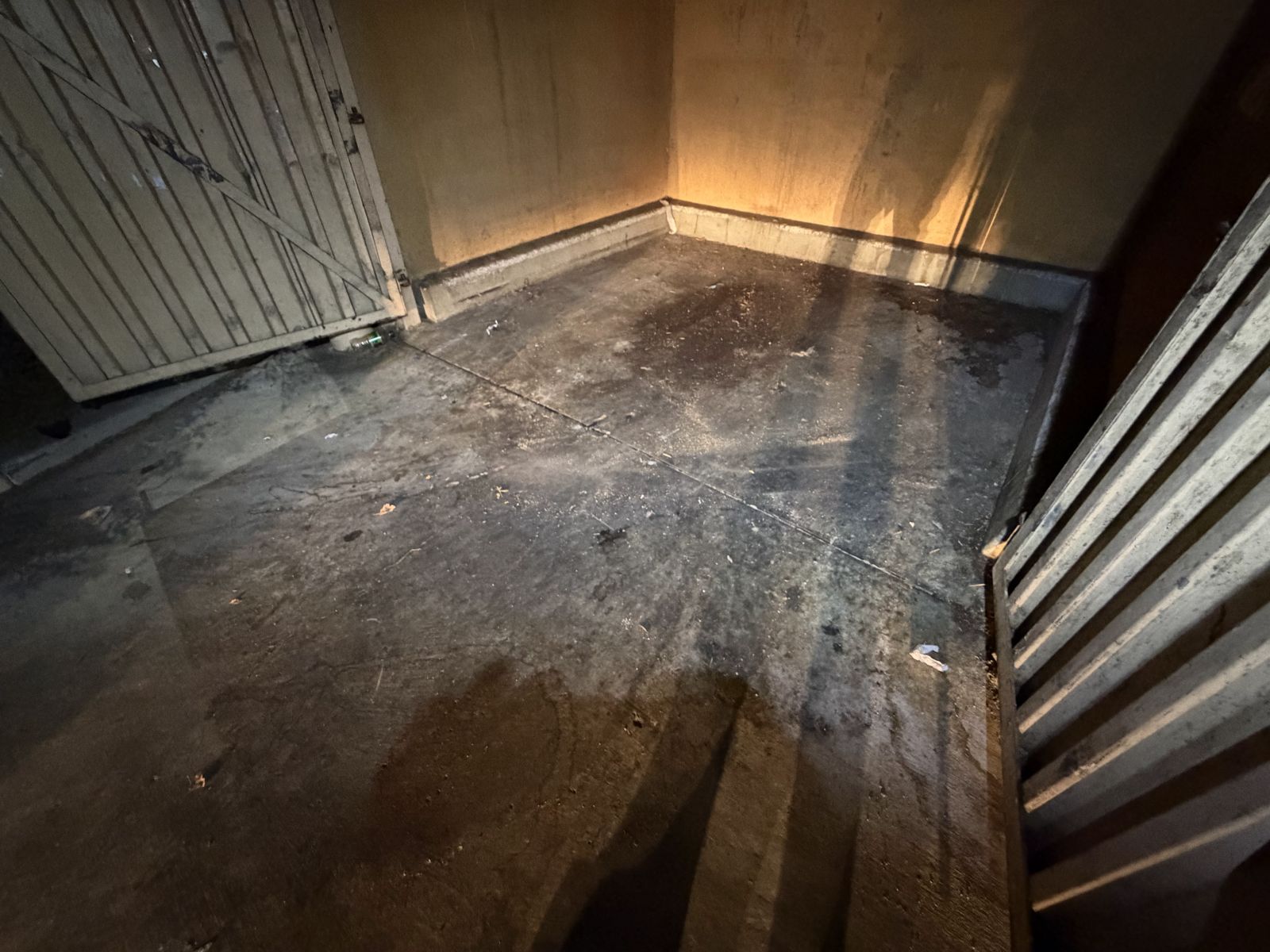 Trash enclosure pad during dumpster pad cleaning