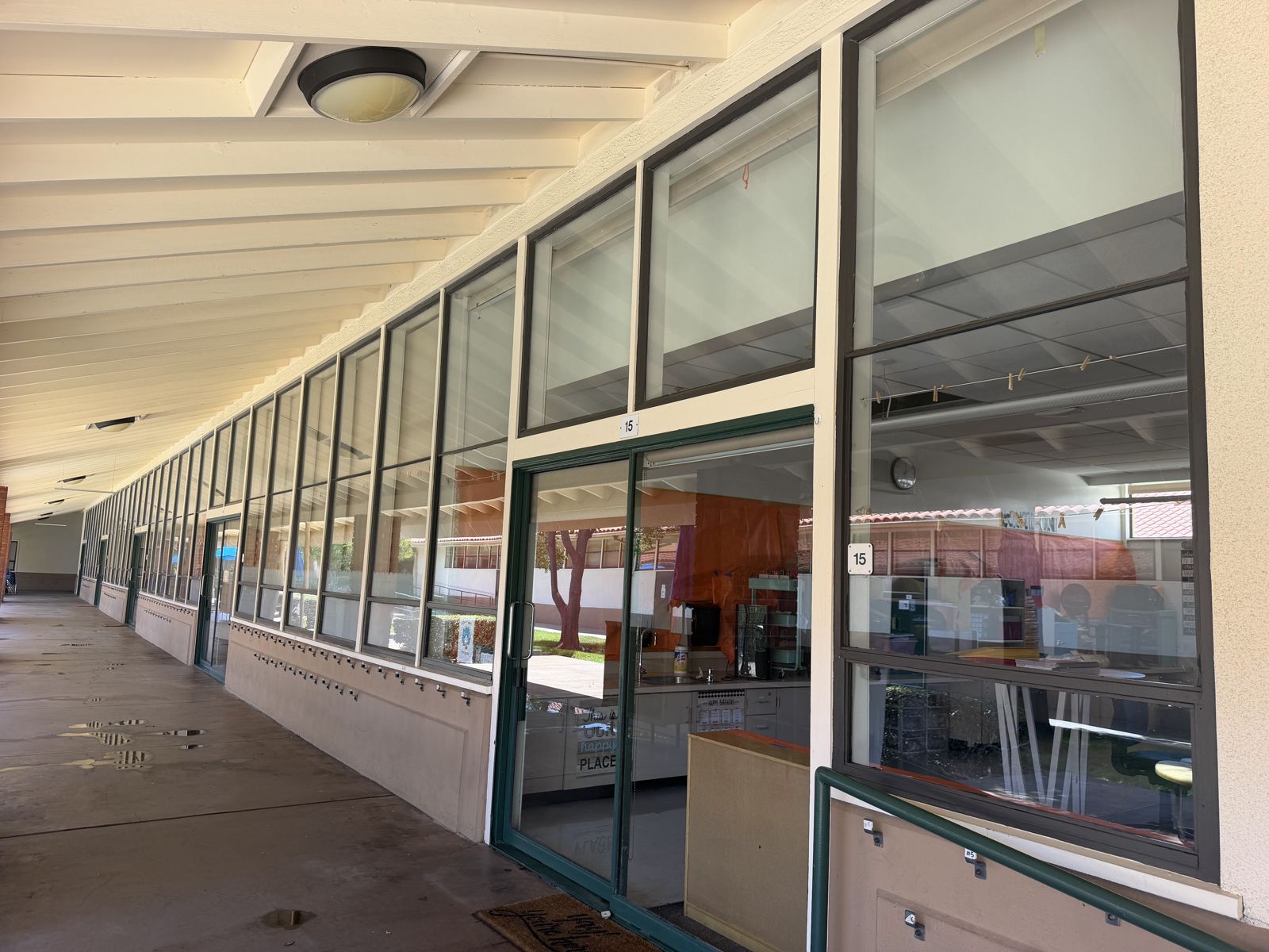 Storefront window cleaning on a commercial building