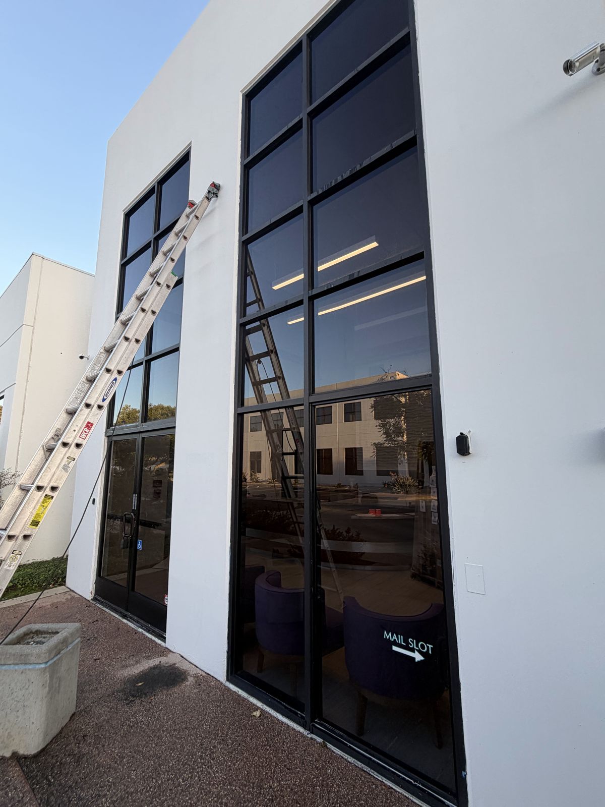 Exterior window and building cleaning on a modern commercial building
