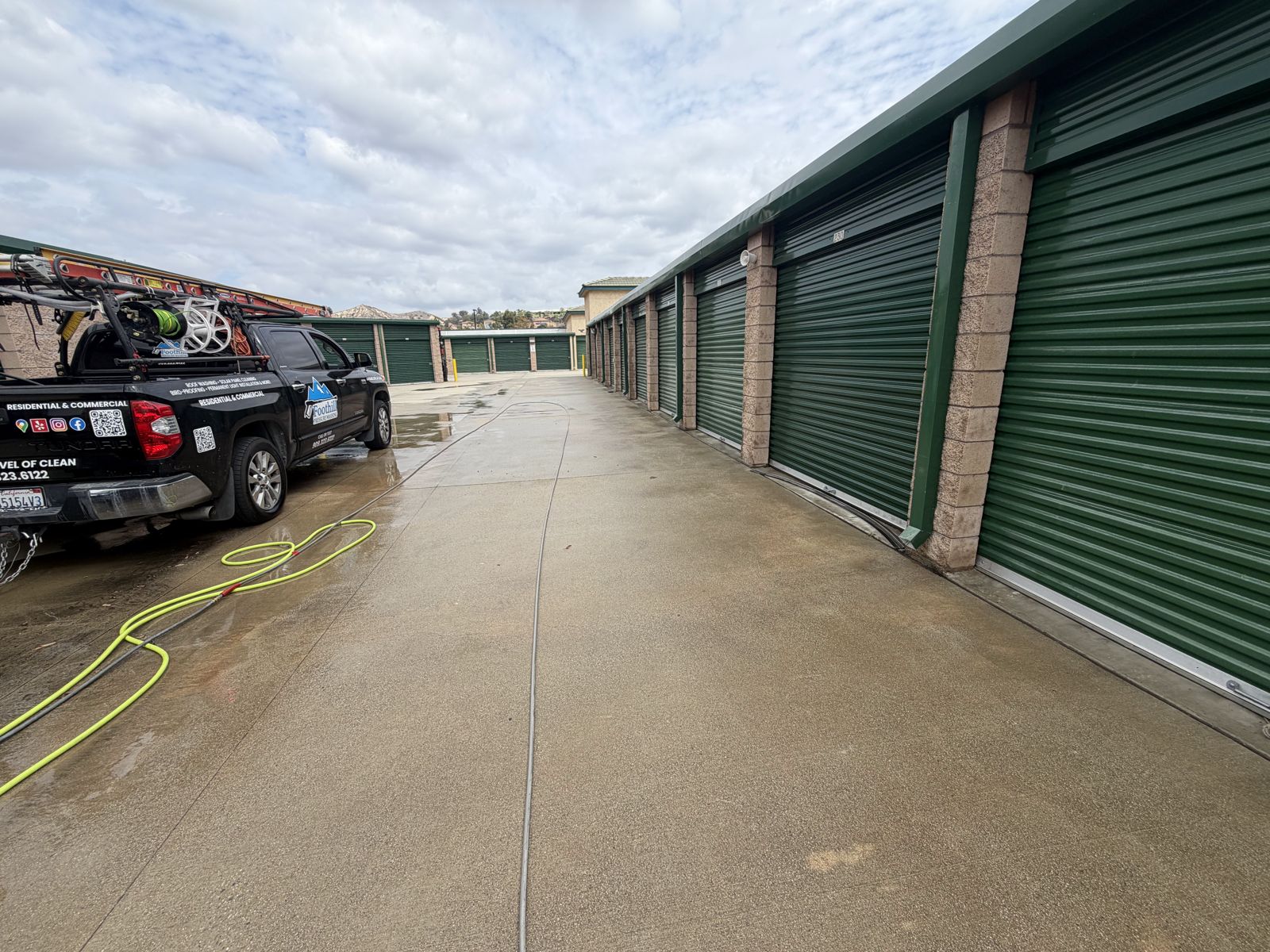 Self-storage facility drive aisle after commercial pressure washing