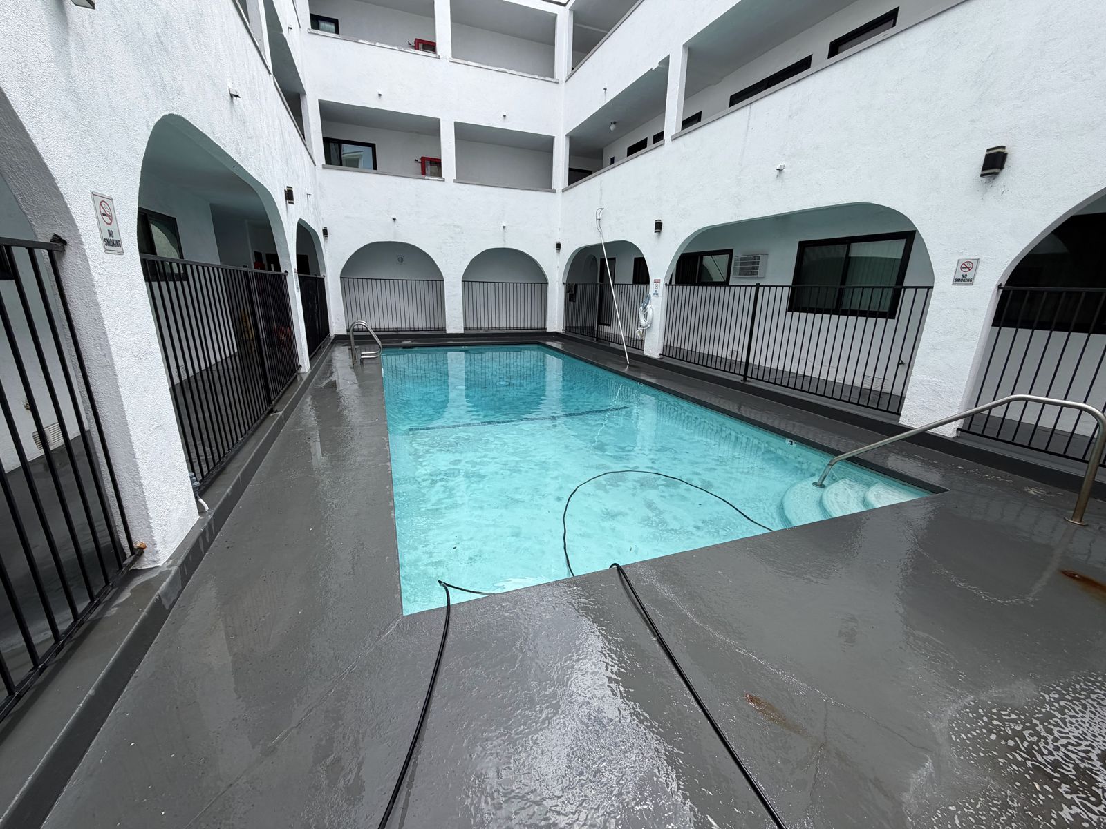 Hotel pool deck after commercial pressure washing