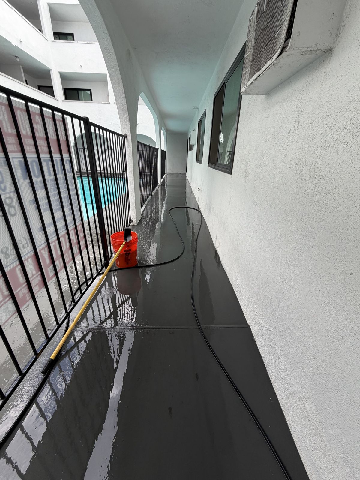 Exterior balcony walkway after pressure washing