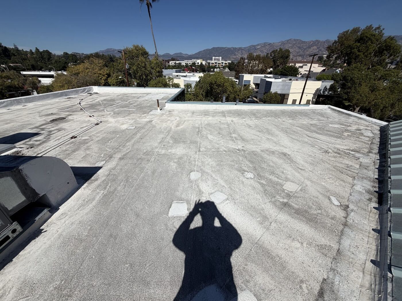 White TPO commercial roof after water-only cleaning